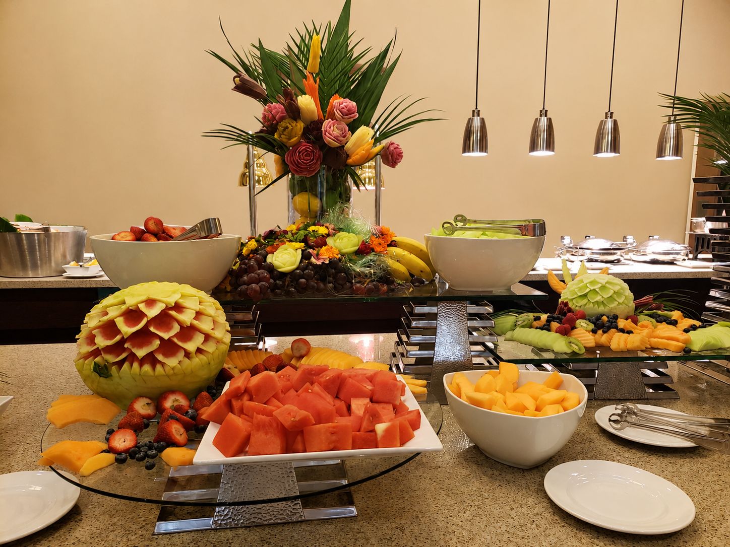 An artfully arranged fresh fruit buffet display